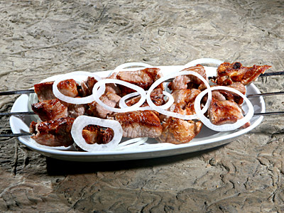 Mtsvadi: Georgian shashlik or kebab (usually beef, pork, or lamb), grilled over a fire and served with onion