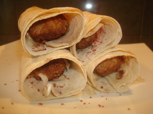 Kababi: another variety of kebab; for this, ground meat is formed on a skewer for cooking, and is served on a lavash with onion (and usually some kind of pinkish-red vegetable-based sauce?)